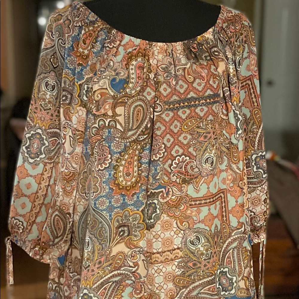 Mid length sleeves. Shirt is sheer material